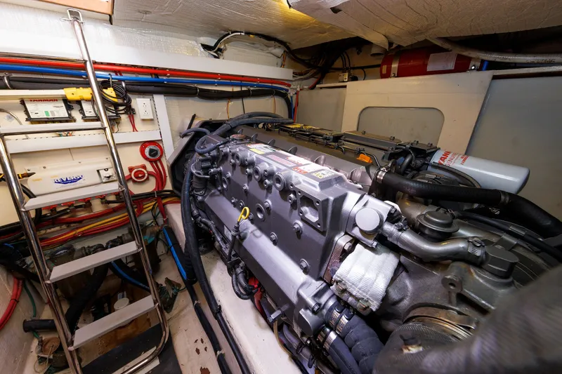 Slide: The Image of Engine room of 2006 Sabre 42 Hard Top Express with visible machinery and wiring. - 56