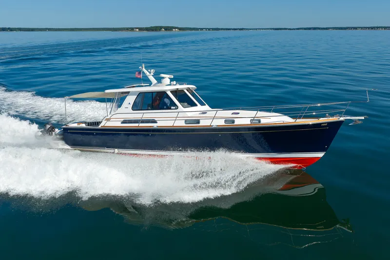 Slide: The Image of 2006 Sabre 42 Hard Top Express cruising on calm blue waters. - 3