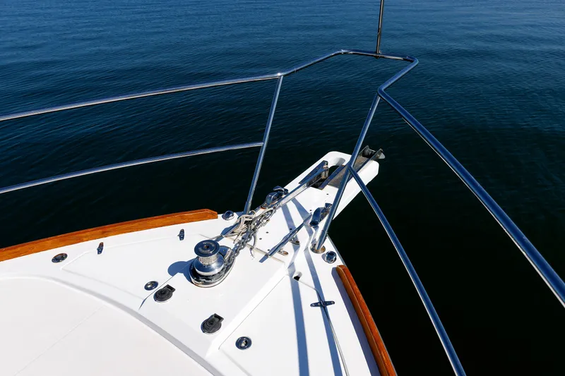 Slide: The Image of Bow of 2006 Sabre 42 Hard Top Express yacht on calm water. - 50
