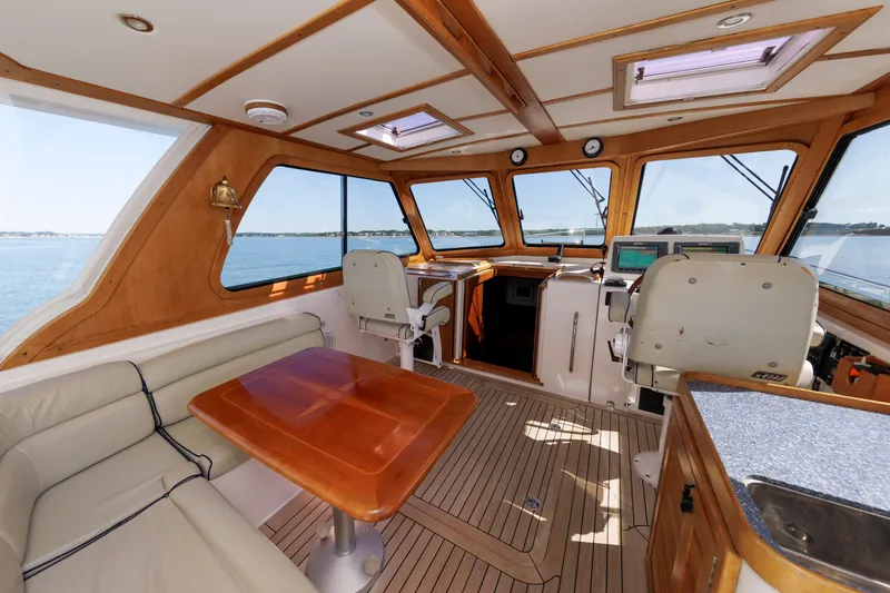 Slide: The Image of Interior of 2006 Sabre 42 Hard Top Express yacht with wooden accents and navigation equipment. - 21