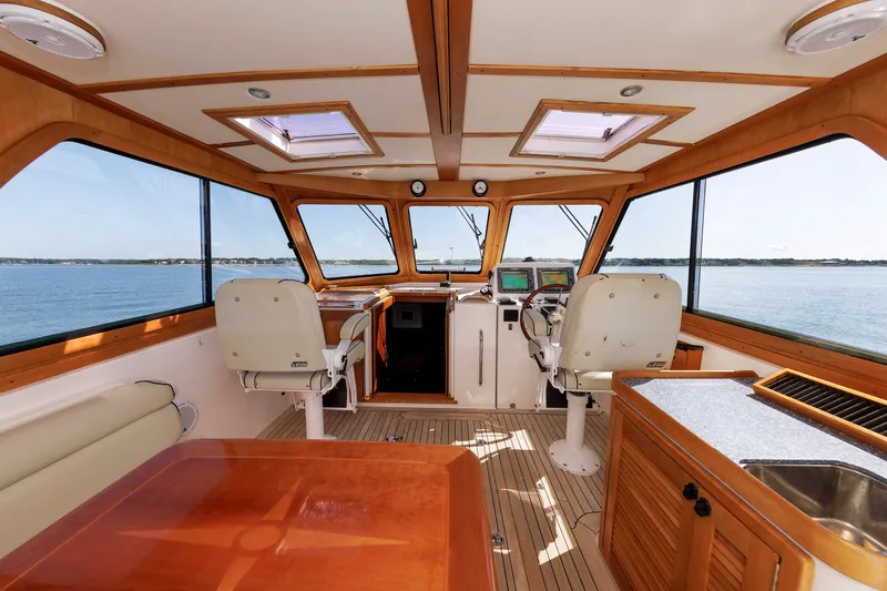 Slide: The Image of Interior of 2006 Sabre 42 Hard Top Express yacht with helm and seating area. - 19