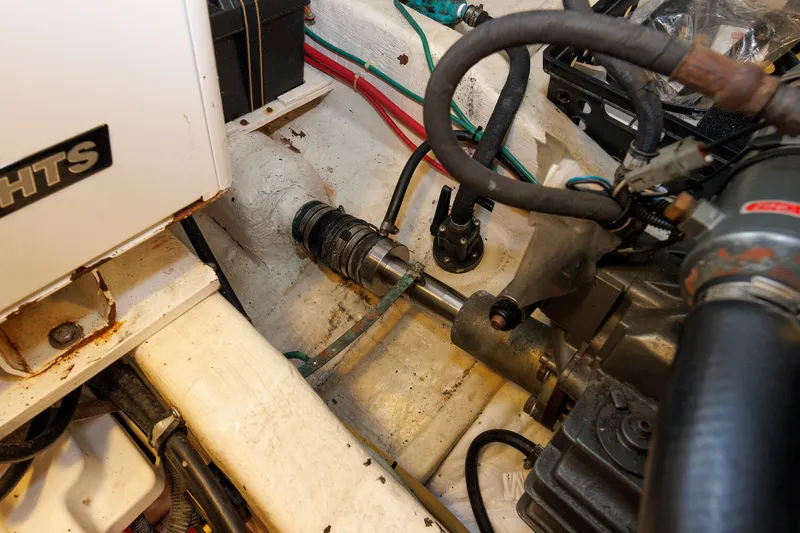 Slide: The Image of Engine compartment of a 2006 Sabre 42 Hard Top Express boat, showing mechanical components. - 55