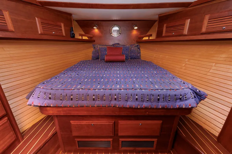 Slide: The Image of Luxurious cabin interior of 2006 Sabre 42 Hard Top Express yacht with cozy bedding. - 39