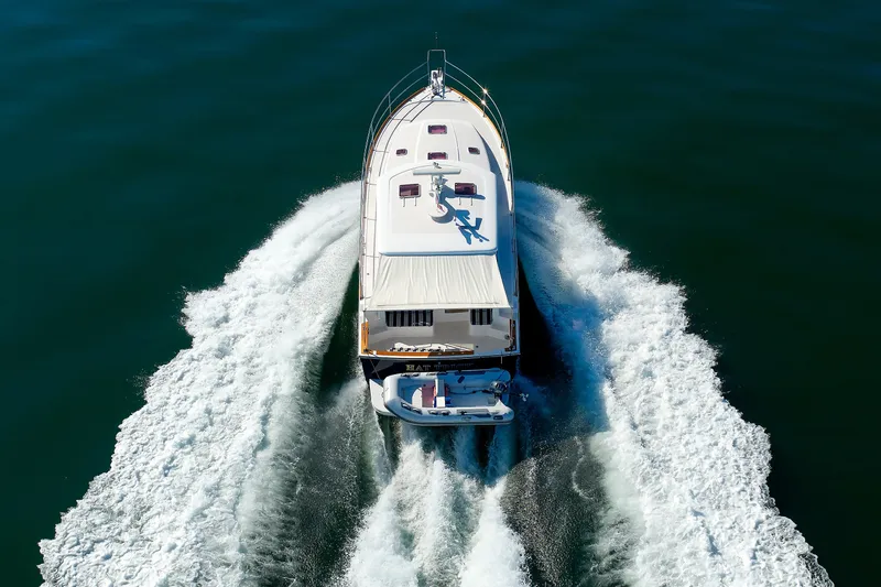 Slide: The Image of 2006 Sabre 42 Hard Top Express cruising on open water, aerial view. - 62
