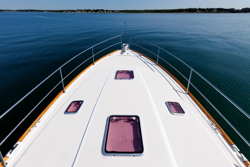 Slide: The Image of Bow view of 2006 Sabre 42 Hard Top Express yacht on calm water. - 49