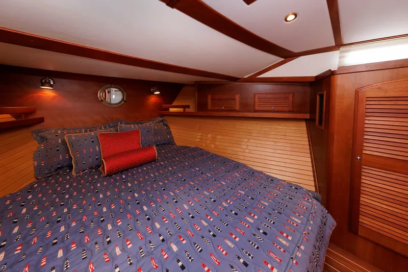 Slide: The Image of Luxurious cabin interior of 2006 Sabre 42 Hard Top Express yacht with nautical bedding. - 40
