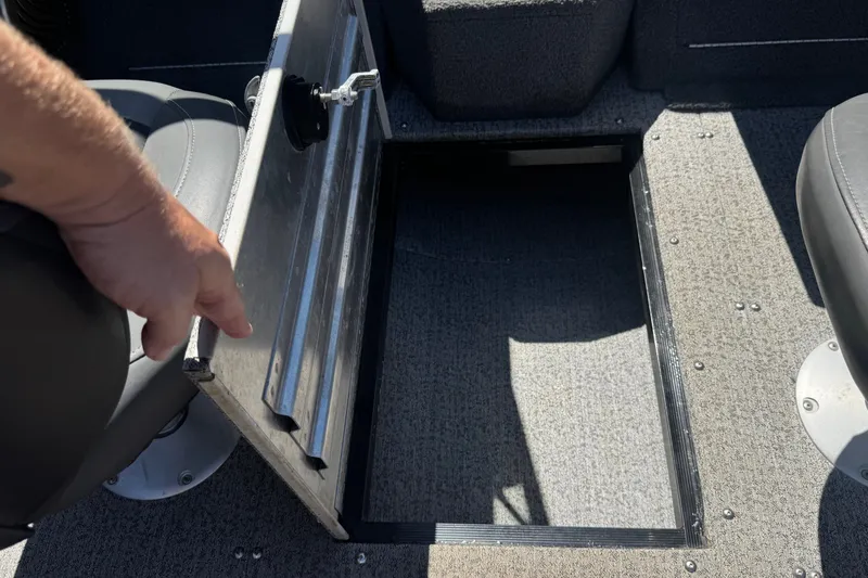Slide: The Image of Open storage compartment on 2022 Tracker Pro Guide V-175 Combo boat interior. - 28