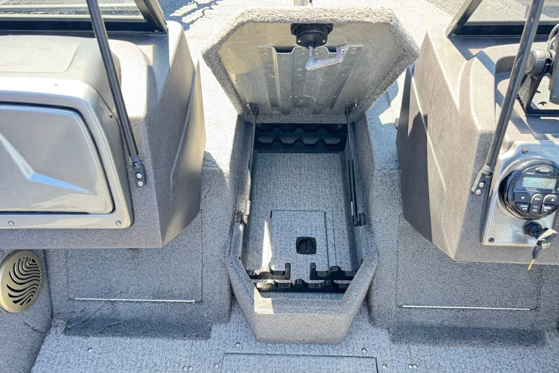 Slide: The Image of 2022 Tracker Pro Guide V-175 Combo boat interior storage compartment open. - 29