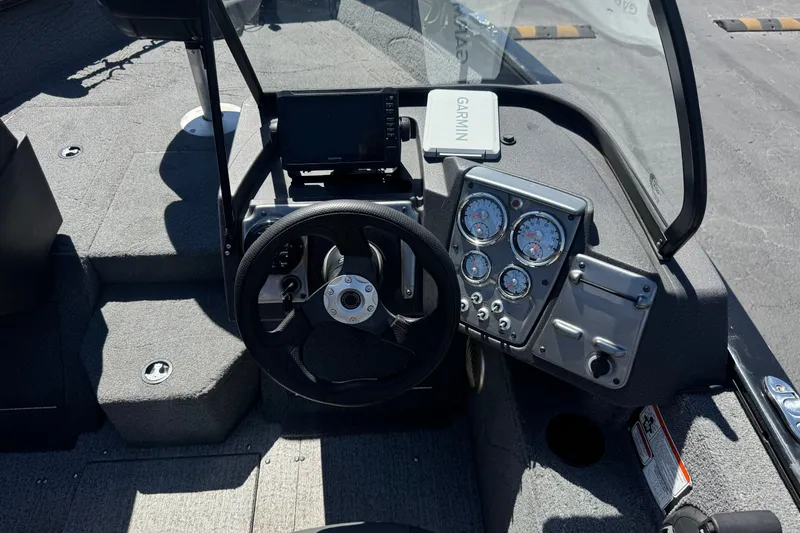 Slide: The Image of 2022 Tracker Pro Guide V-175 Combo boat dashboard with steering wheel and Garmin device. - 31