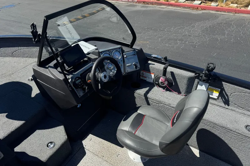 Slide: The Image of 2022 Tracker Pro Guide V-175 Combo boat interior with steering wheel and dashboard controls. - 30
