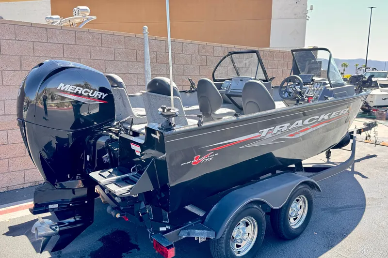 Slide: The Image of 2022 Tracker Pro Guide V-175 Combo boat with Mercury engine on trailer. - 5