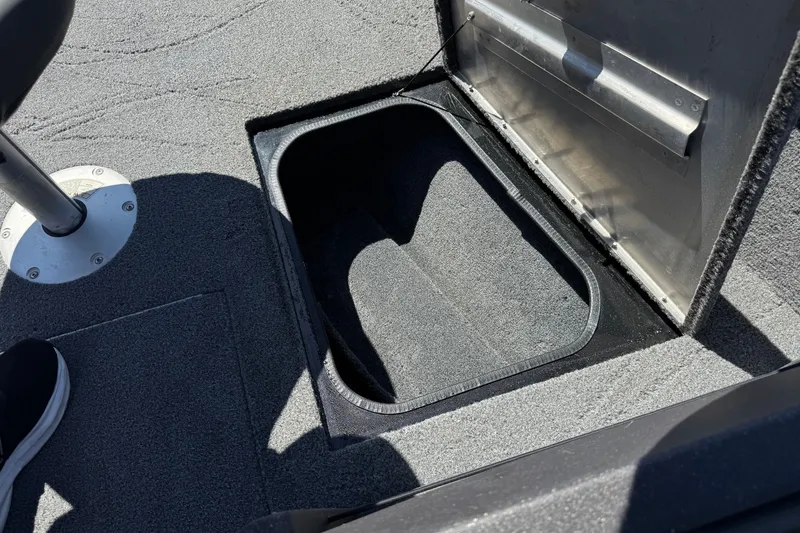 Slide: The Image of Open storage compartment in 2022 Tracker Pro Guide V-175 Combo boat. - 15