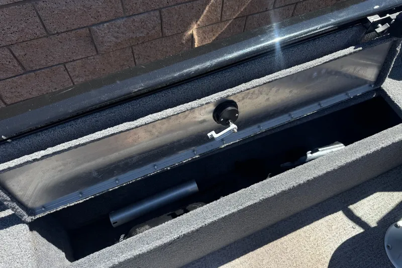 Slide: The Image of Open storage compartment in 2022 Tracker Pro Guide V-175 Combo boat. - 26