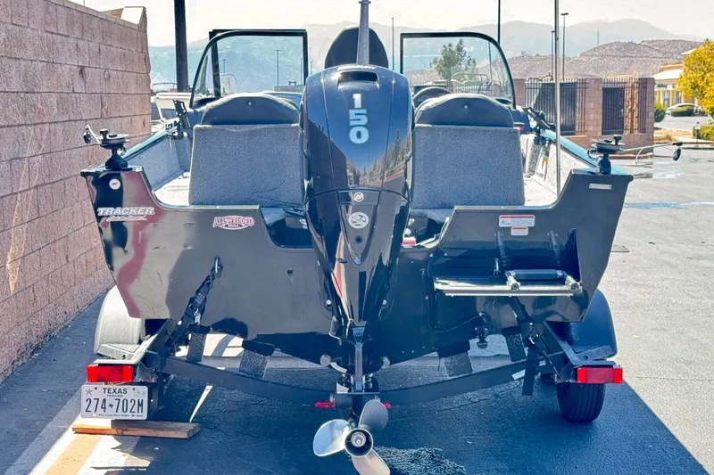 Slide: The Image of 2022 Tracker Pro Guide V-175 Combo boat with 150 HP engine, parked on trailer. - 4