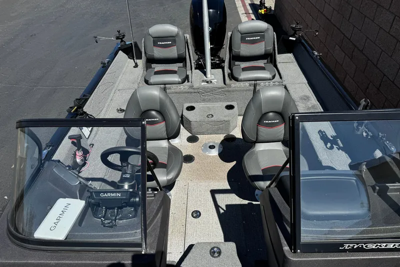 Slide: The Image of 2022 Tracker Pro Guide V-175 Combo boat interior with Garmin equipment and seating. - 16