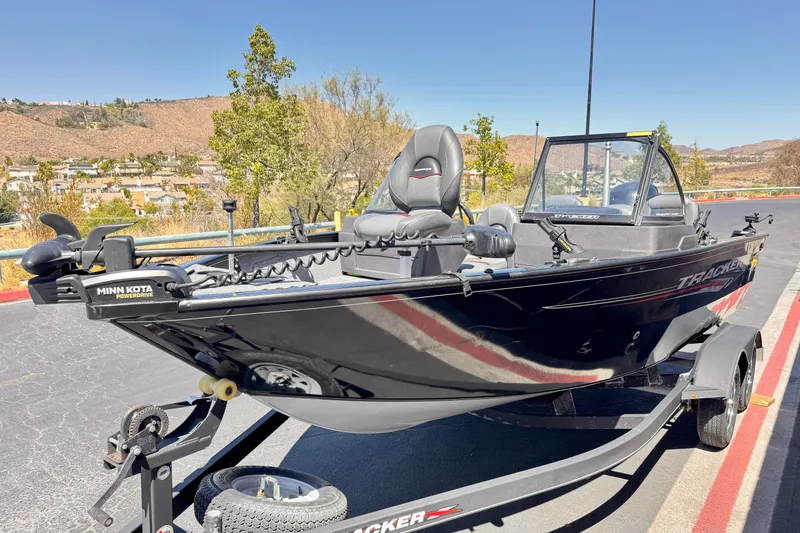 Slide: The Image of 2022 Tracker Pro Guide V-175 Combo boat on trailer, featuring Minn Kota PowerDrive motor. - 3