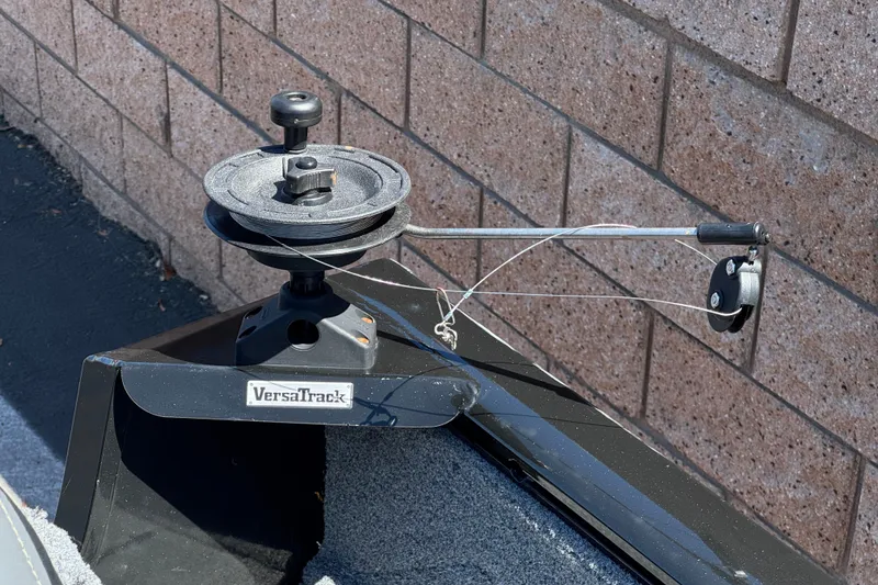 Slide: The Image of VersaTrack system on 2022 Tracker Pro Guide V-175 Combo boat, featuring a mounted pulley mechanism. - 21
