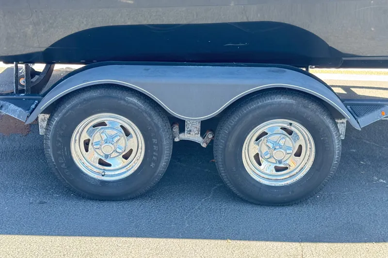 Slide: The Image of Trailer wheels of a 2022 Tracker Pro Guide V-175 Combo boat. - 33