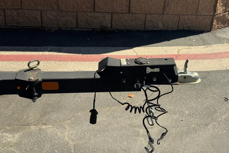 Slide: The Image of Trailer hitch of a 2022 Tracker Pro Guide V-175 Combo on pavement. - 34