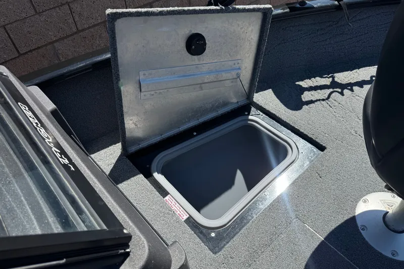 Slide: The Image of Open storage compartment on 2022 Tracker Pro Guide V-175 Combo boat deck. - 14