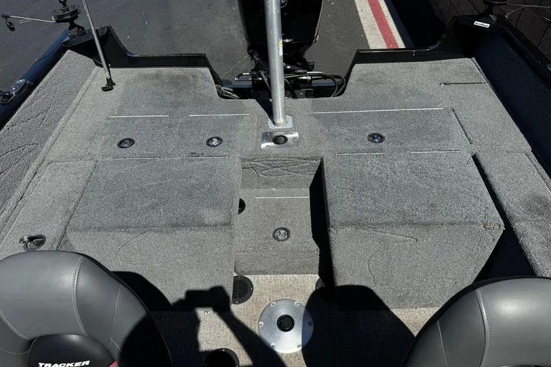 Slide: The Image of 2022 Tracker Pro Guide V-175 Combo boat interior with gray carpet and seating. - 19