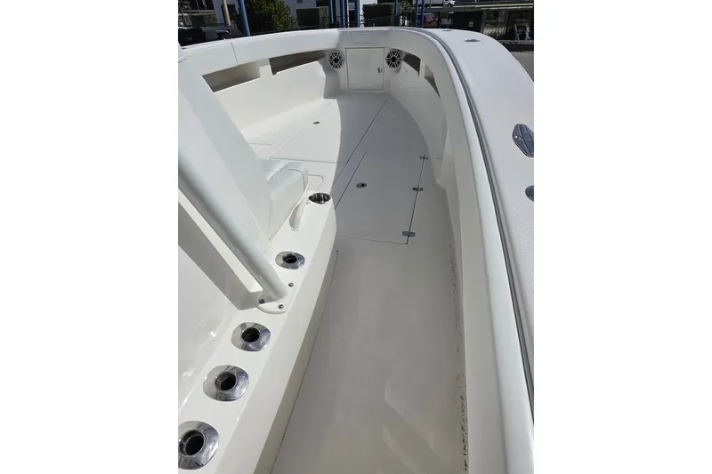 Slide: The Image of 2023 SeaVee 340B boat deck, featuring sleek design and multiple rod holders. - 8