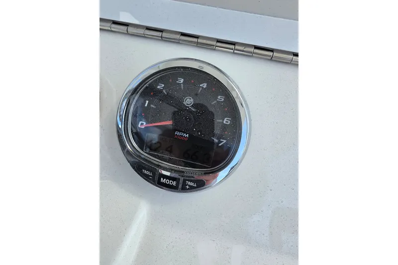 Slide: The Image of Tachometer of 2023 SeaVee 340B boat displaying RPM with troll mode buttons. - 19