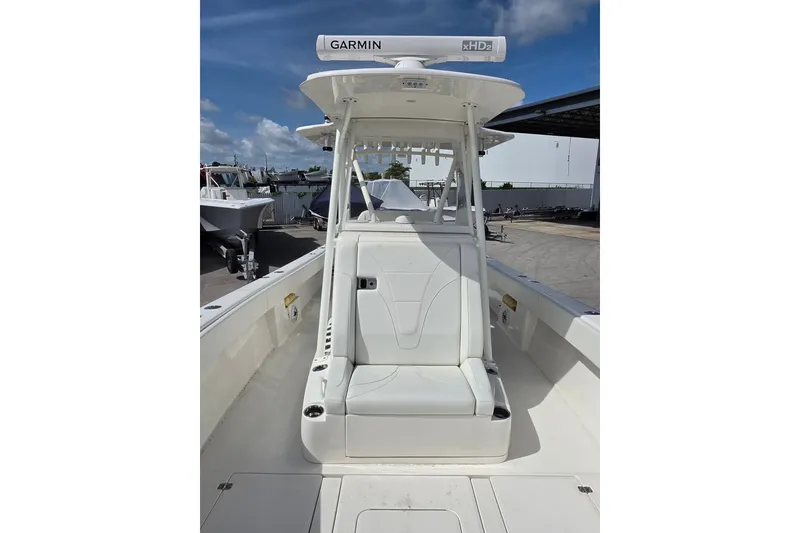 Slide: The Image of 2023 SeaVee 340B boat with Garmin radar, featuring sleek white seating and console. - 22