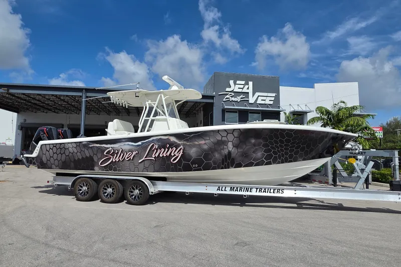The Image of 2023 SeaVee 340B boat named "Silver Lining" on trailer at SeaVee dealership. - 1