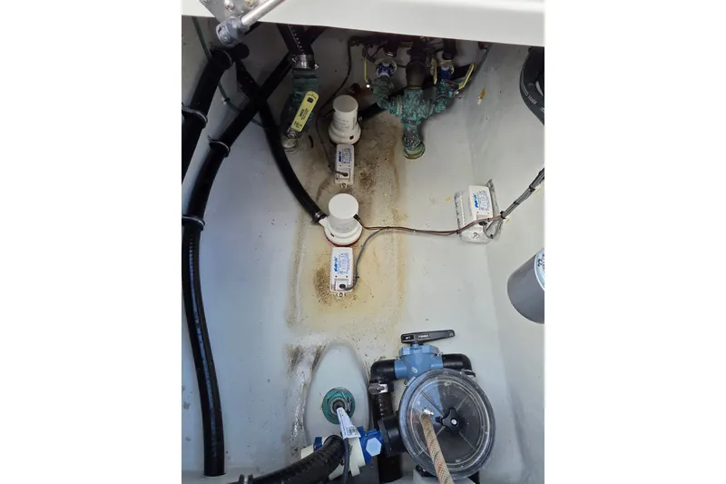 Slide: The Image of 2023 SeaVee 340B boat bilge area with pumps and wiring. - 14