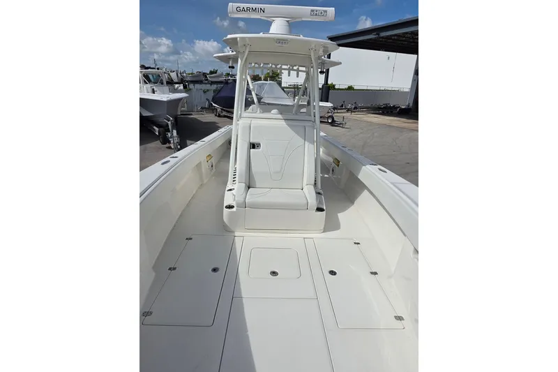Slide: The Image of 2023 SeaVee 340B boat with Garmin radar, spacious deck, and sleek design. - 9