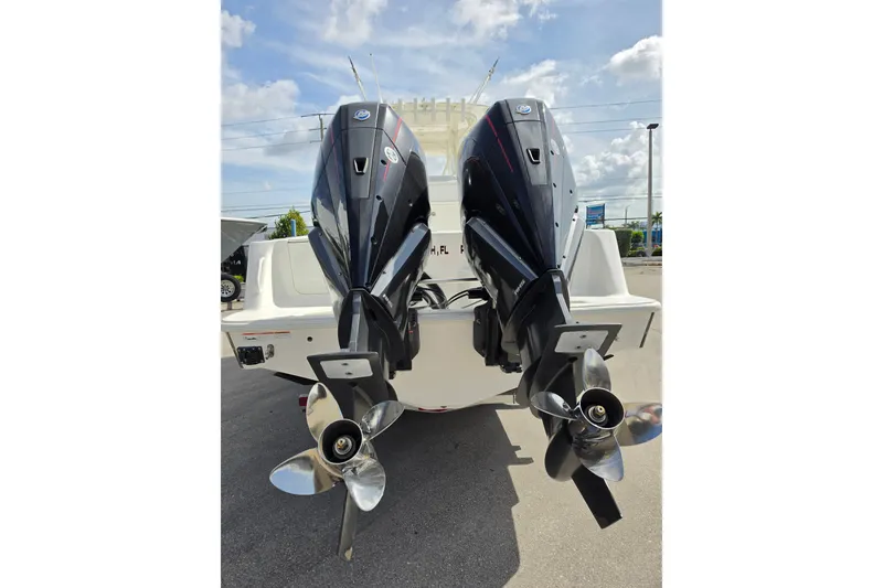 Slide: The Image of 2023 SeaVee 340B boat with dual outboard engines, viewed from the rear. - 4
