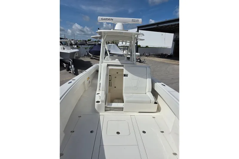 Slide: The Image of 2023 SeaVee 340B boat with Garmin equipment, docked under a clear blue sky. - 17