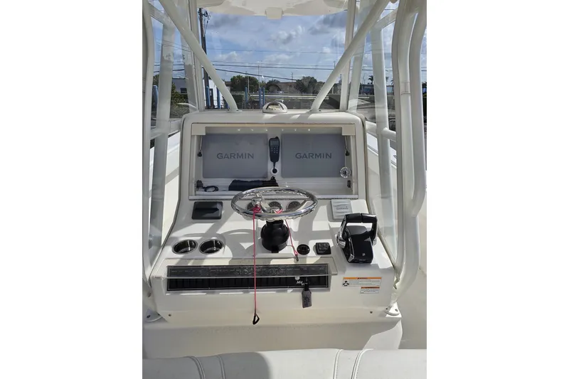 Slide: The Image of 2023 SeaVee 340B boat console with Garmin navigation system and steering wheel. - 7