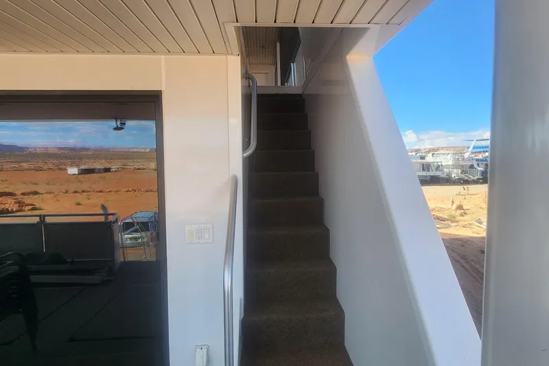 Slide: The Image of Staircase on Adonia Legacy Trip #15 houseboat, desert landscape view, 2022. - 16