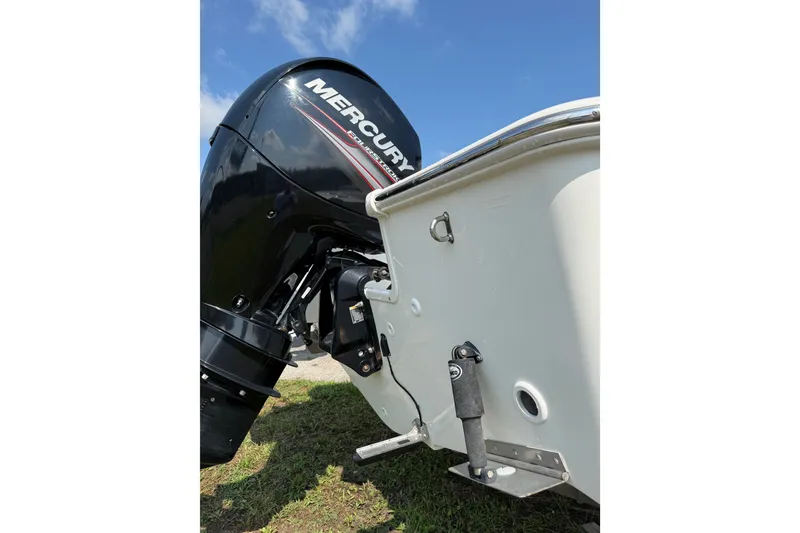 Slide: The Image of 2019 Boston Whaler 210 Montauk with Mercury outboard engine, viewed from the rear. - 4