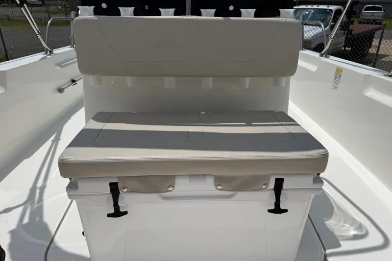 Slide: The Image of 2019 Boston Whaler 210 Montauk boat seating with storage compartment. - 11