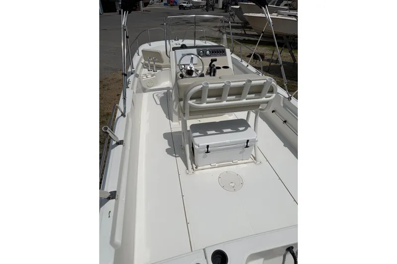 Slide: The Image of 2019 Boston Whaler 210 Montauk boat interior with steering console and seating. - 7