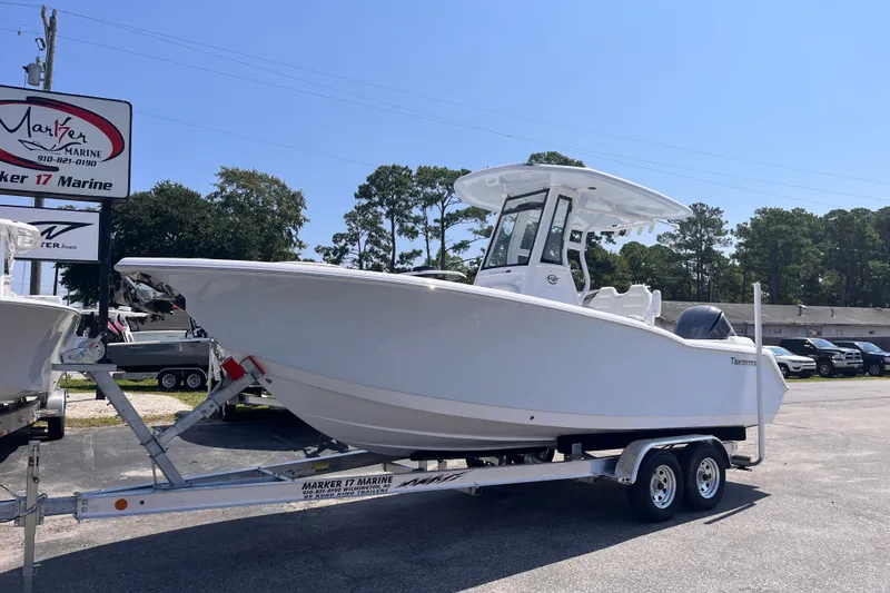 Slide: The Image of 2027 Tidewater 232 LXF boat on trailer at Marker 17 Marine dealership. - 1