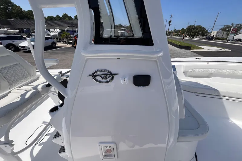 Slide: The Image of 2027 Tidewater 232 LXF boat interior, featuring sleek white design and modern seating. - 14