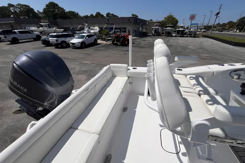 Slide: The Image of 2027 Tidewater 232 LXF boat with Yamaha engine, parked in dealership lot. - 17