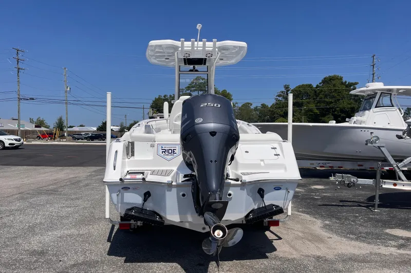 Slide: The Image of 2027 Tidewater 232 LXF boat with Yamaha 250 engine, parked outdoors. - 3