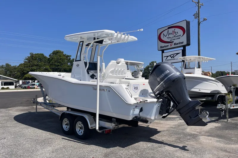 Slide: The Image of 2027 Tidewater 232 LXF boat with Yamaha engine on trailer at dealership. - 2