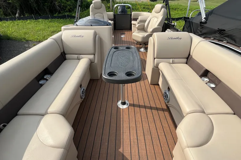 Slide: The Image of 2024 Bentley Pontoons Legacy 240 Navigator interior with luxurious seating and elegant design. - 12