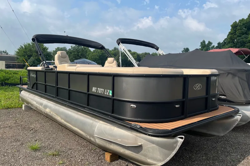 The Image of 2024 Bentley Pontoons Legacy 240 Navigator on display, featuring sleek design and comfortable seating. - 0