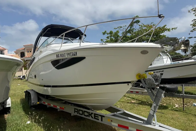 Slide: The Image of 2022 Regal 26 XO boat on trailer, labeled "Big Boat Energy," outdoors under blue sky. - 20