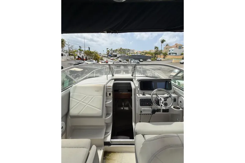 Slide: The Image of 2022 Regal 26 XO boat interior with modern dashboard and steering wheel. - 10