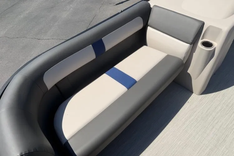Slide: The Image of 2026 Princecraft Jazz 170 boat interior with gray and beige seating, cup holder. - 9