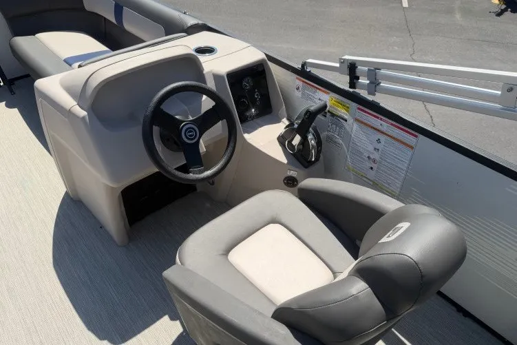 Slide: The Image of 2026 Princecraft Jazz 170 boat interior with steering wheel and seating. - 11