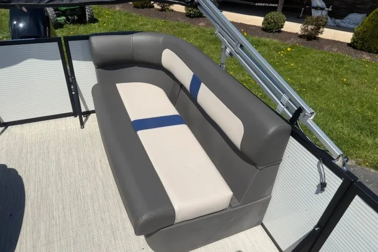 Slide: The Image of 2026 Princecraft Jazz 170 boat interior with gray and beige seating. - 16